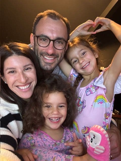 Abby with her husband and daughters giving moral support before sharing her story on a zoom meeting.
