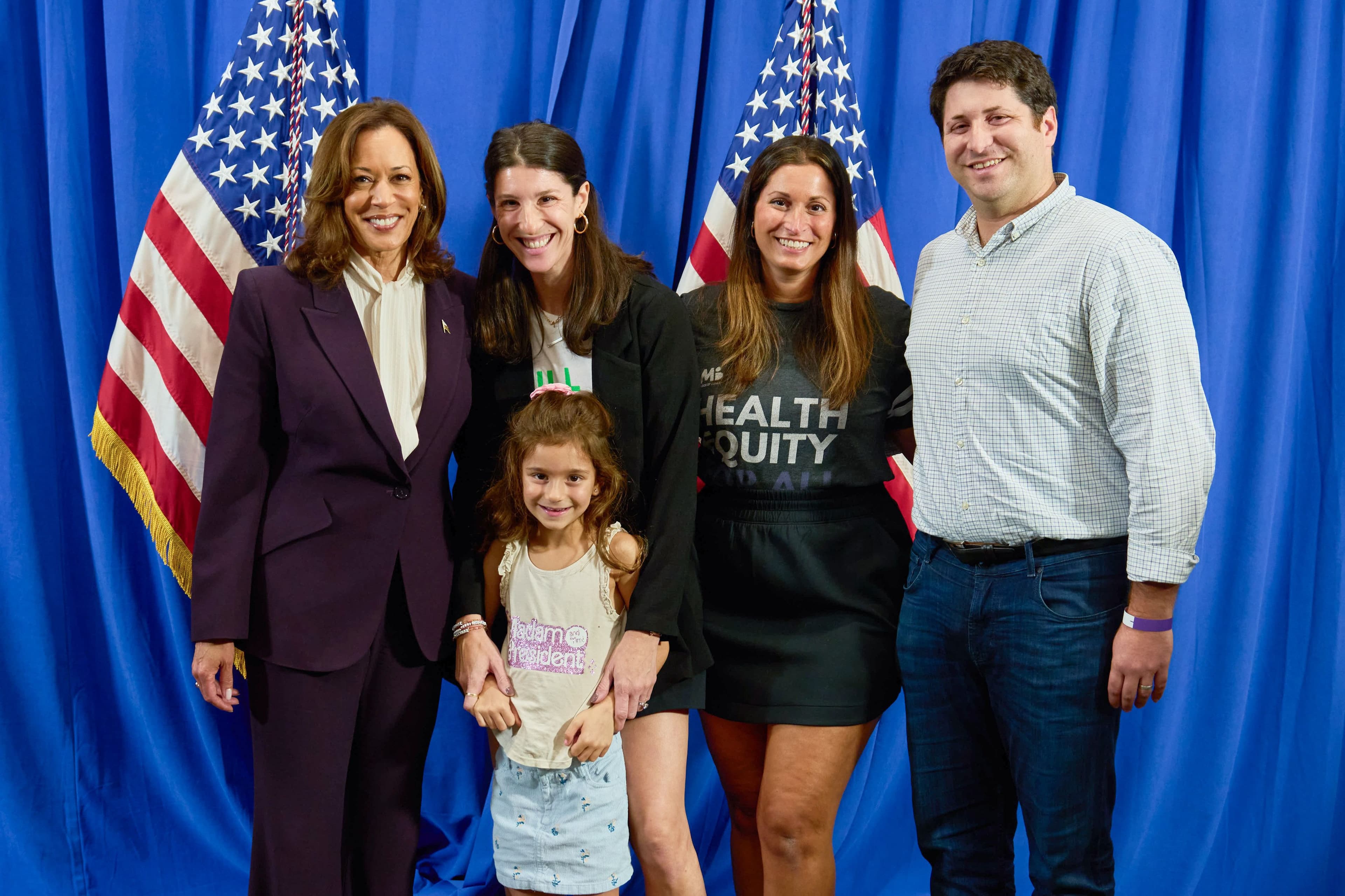 Abby with her daughter, sister, and brother on the campaign trail for Vice President Kamala Harris.